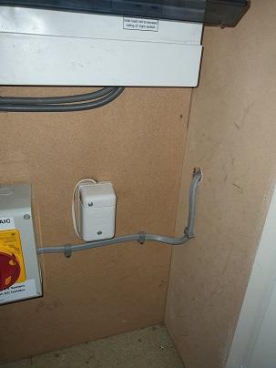 Meter box under stairs. Shows Solar panel route on right to roof space